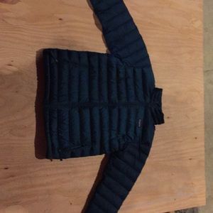 A blue Patagonia down jacket